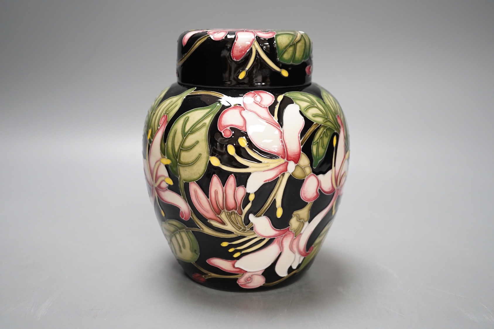 A Moorcroft 'Karzai honeysuckle' jar and cover, by Kerry Goodwin, numbered edition 769/6, 2012, boxed, 15 cms high.